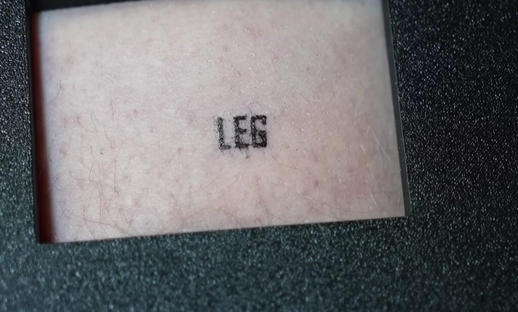 Tattooing with a 3D Printer. The DIY 3D printer managed to print a word. Tattooing with a 3D Printer. The DIY 3D printer managed to print a word. Photo.
