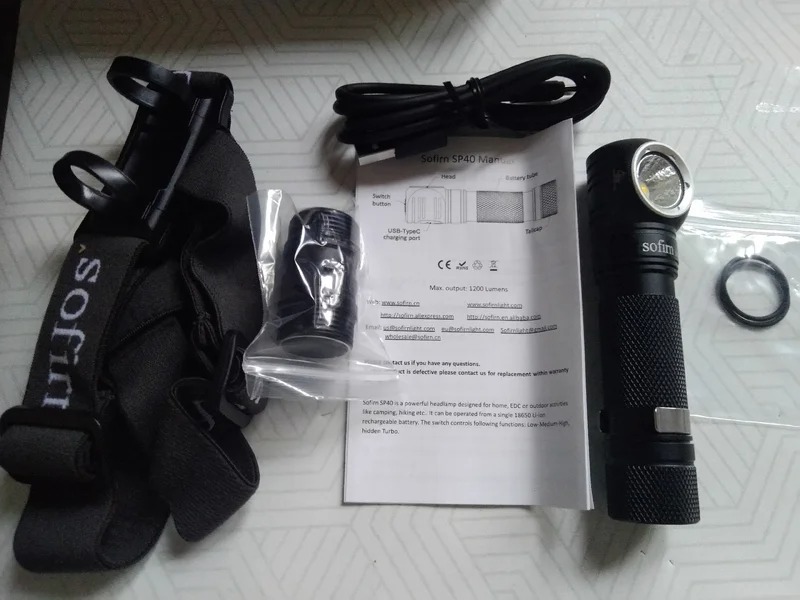 Rechargeable headlamp. The kit includes a head mount and the flashlight itself. Photo.