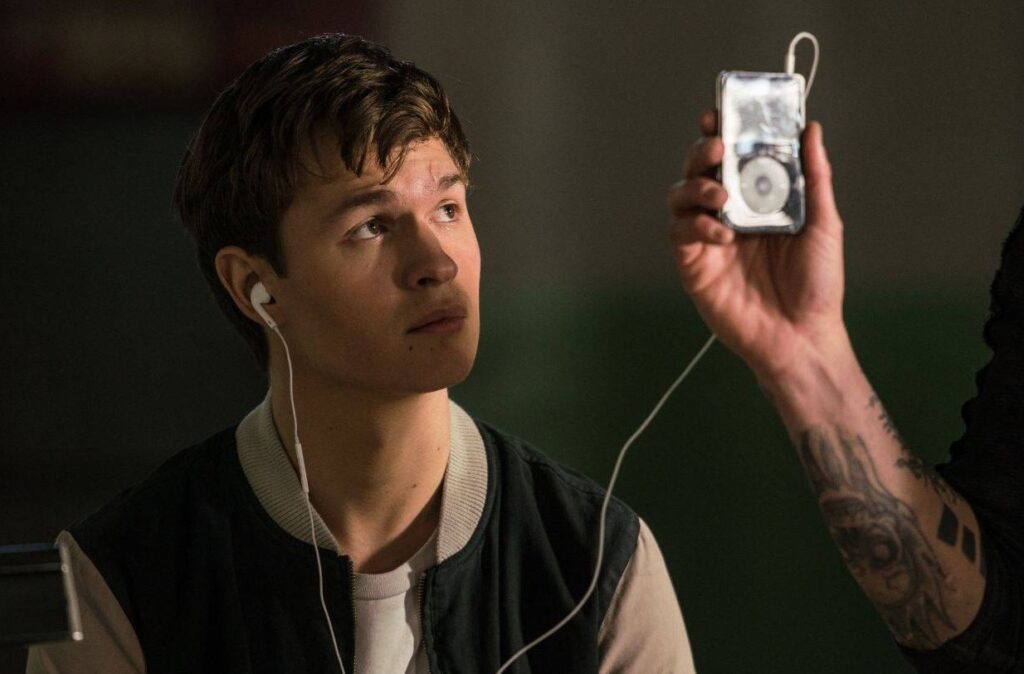 The habit of listening to music with one earbud seems harmless, but it creates an uneven strain on your hearing. Still from the movie "Baby Driver"