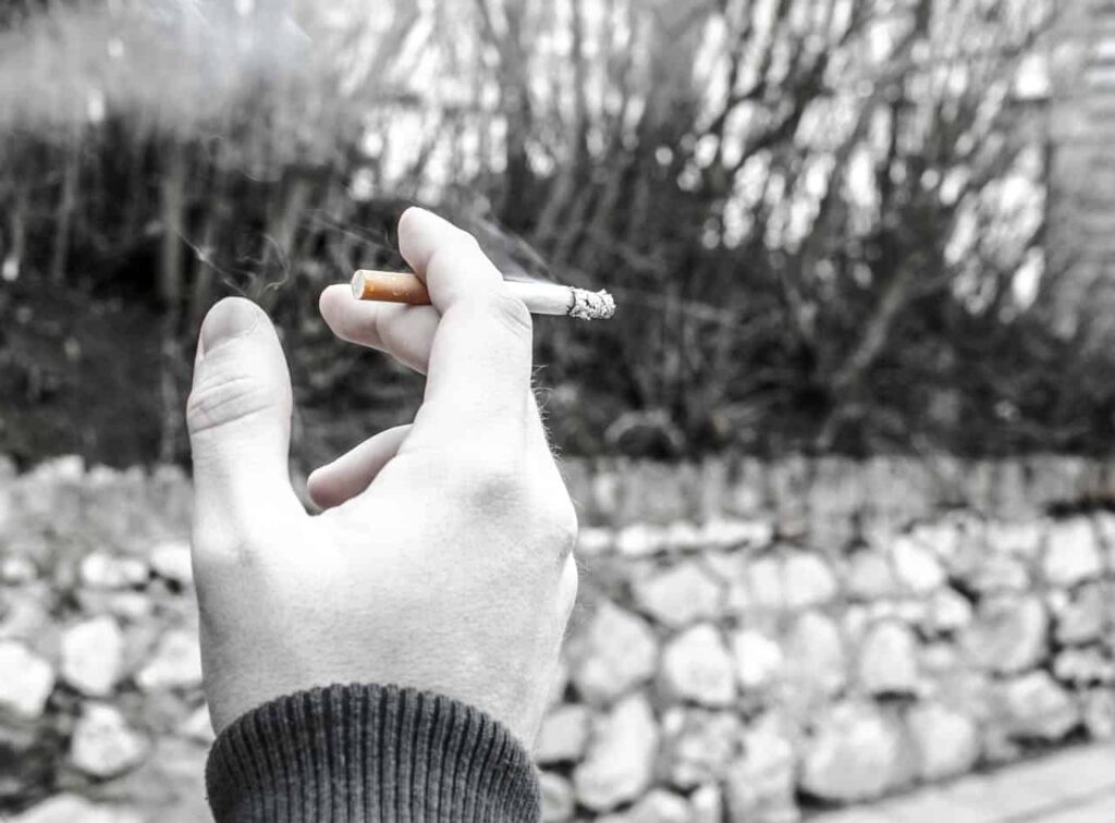 What happens to cigarettes when we throw them on the ground. Thousands of cigarette butts on a wet city sidewalk — a familiar sight after rain. Image source: zmescience.com. Photo.