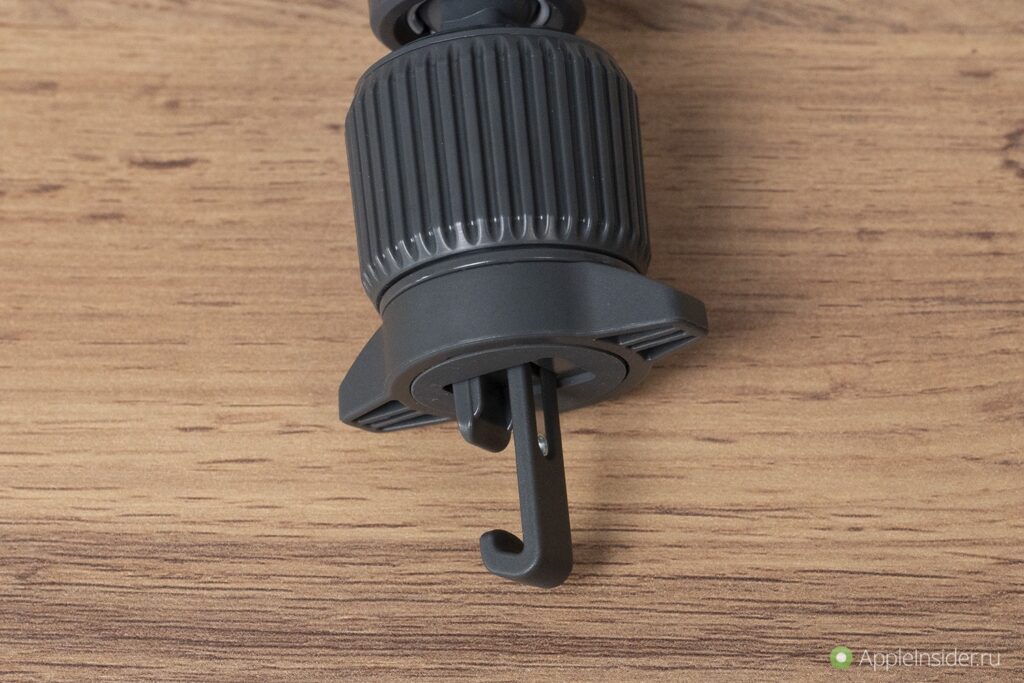 MagSafe Wireless Car Charger for iPhone. Insert this hook into the vent, twist the body, and it locks in place. Just don't overtighten. Photo.