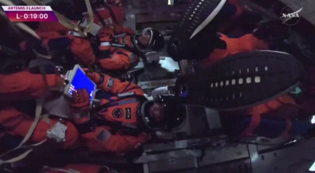 Crew inside the spacecraft. Image source: Science Alert. Photo.