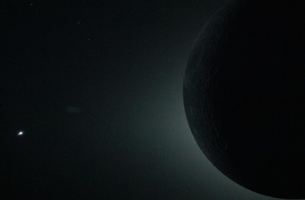 The bright dot on the left is Venus. Image source: NASA. Photo.