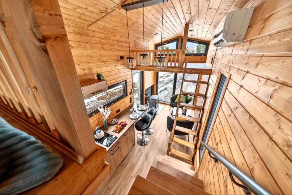 The Katrin interior is finished with Scandinavian spruce, giving it an attractive log-cabin look. Image source: craft-house.eu. Photo.