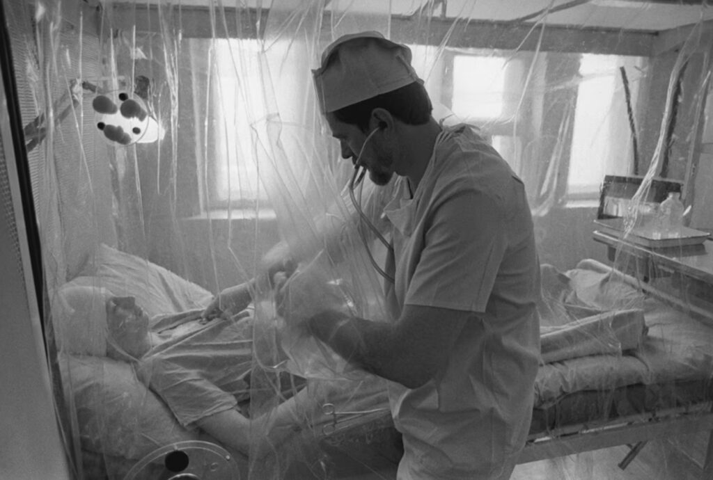 Examination of a patient with radiation sickness. Image source: theatlantic.com. Photo.