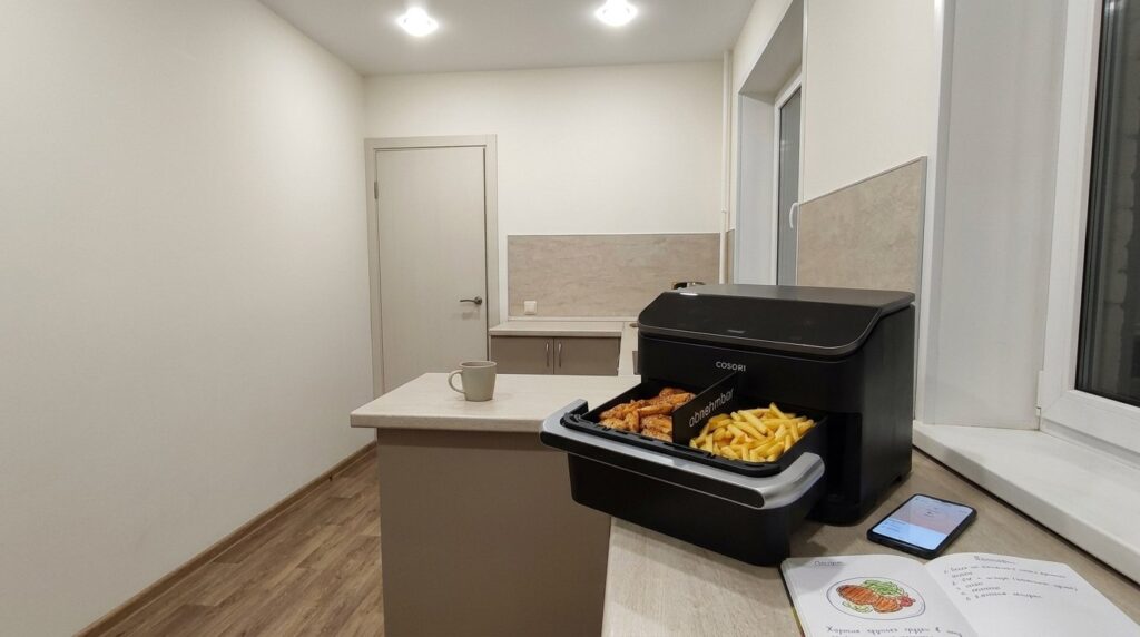 Cosori TF102S: Air fryer with two cooking zones. You can cook two dishes at once. Photo.