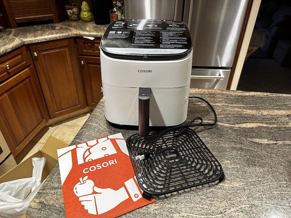 An air fryer will not only complement your kitchen interior but also let you cook quickly and deliciously. Photo.