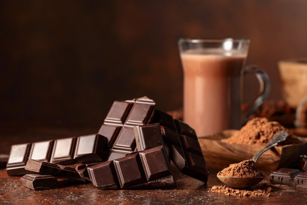 Real chocolate breaks with a characteristic crisp snap. Photo.