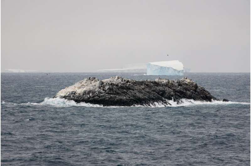 Aerial drone photography of the new island — a rock among drifting icebergs