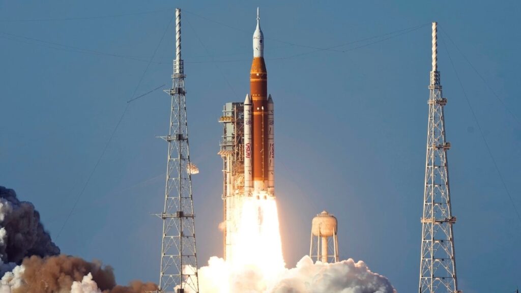 SLS rocket launches from Kennedy Space Center at sunset. Photo.