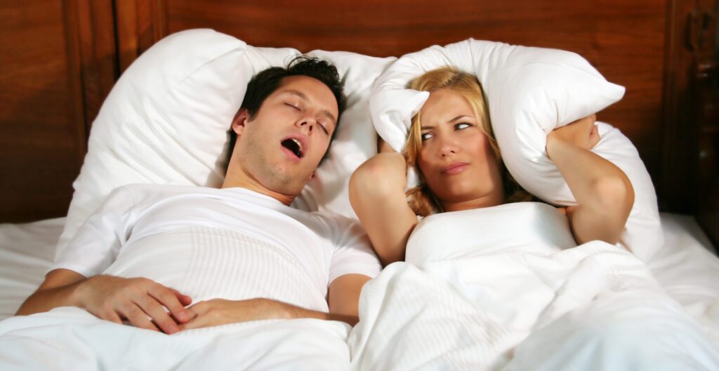 One partner can't fall asleep because of the other's snoring. Image source: storage.googleapis.com. Photo.