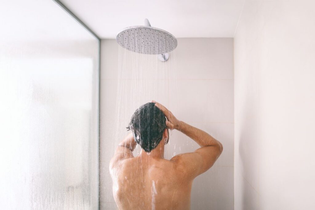 Dry and flaky skin on the hands is one sign of hot water overuse. Photo.
