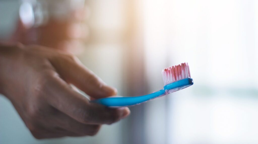A soft brush (left) cleans just as well as a hard one, but doesn't injure gums. Photo.