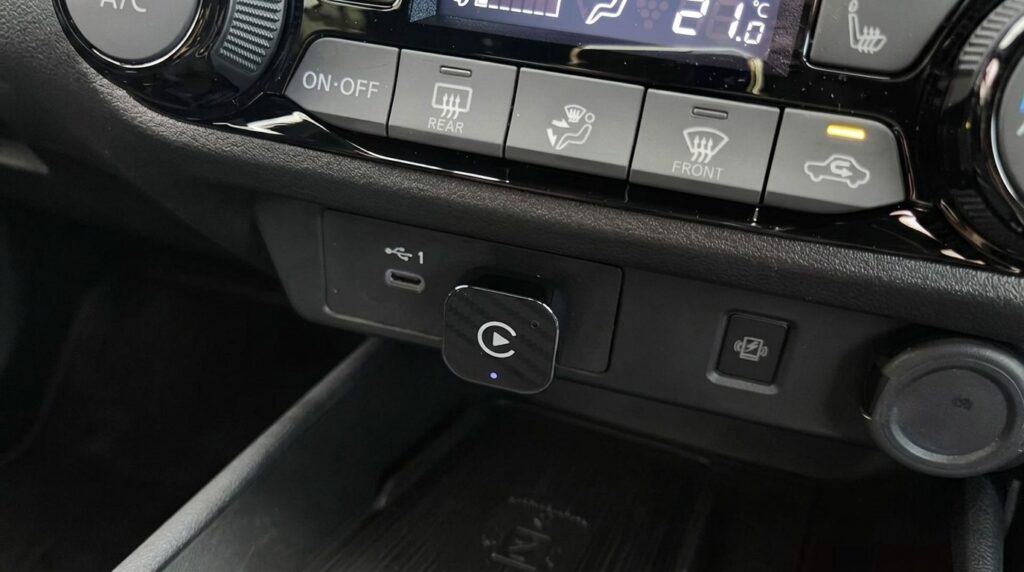 Plugged it into the stereo's USB — iPhone connects automatically, no cable needed. Photo.