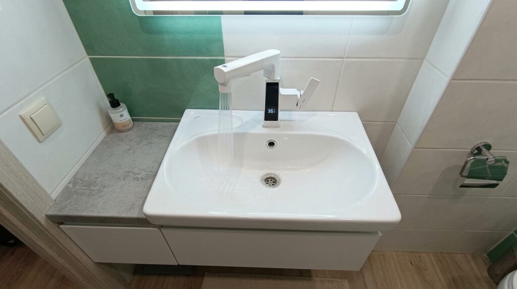 Faucet with Temperature Sensor — Installed It and Love It. A screen on a faucet sounds weird until you start washing your hands in ice-cold water blindly. Photo.