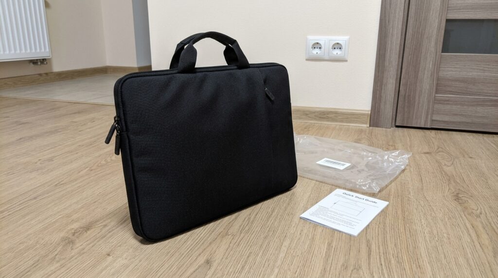 Laptop bag — I carry my MacBook every day and don't fear the rain. Been carrying my MacBook Air in it since January — got caught in the rain about five times, dry inside. Photo.