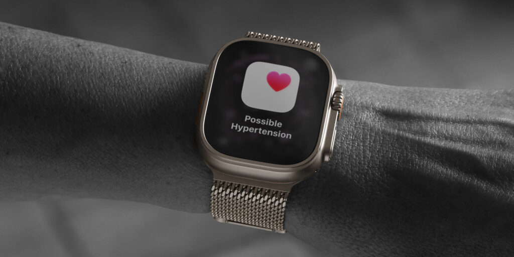 Apple Watch Ultra next to a traditional blood pressure monitor