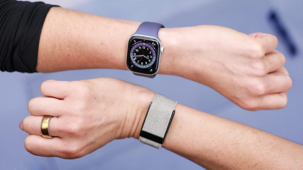 Apple Watch and Whoop: How They Differ. One device is a full-fledged smartwatch, and the other is a screenless band. Photo.