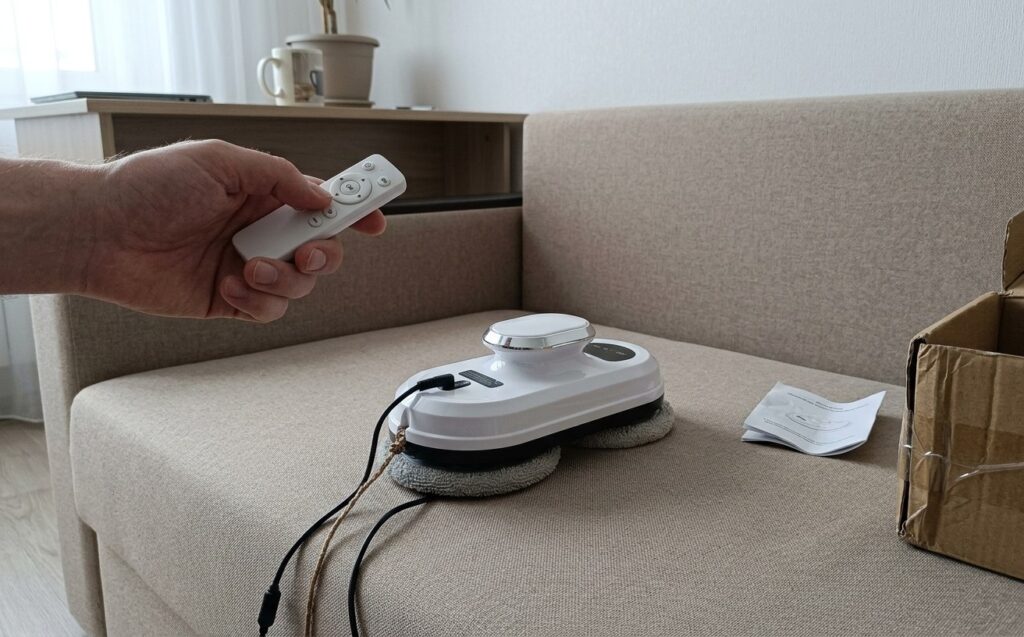 How the window cleaning robot works. Remote control is implemented as simply and intuitively as possible. Photo.
