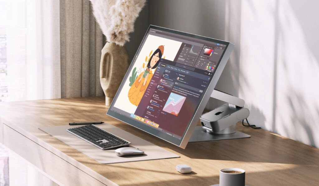 How to hide a Mac mini behind a monitor without extra cables. The Mac mini hides in the stand at the back. But keep in mind that only the M4 model will fit. Photo.