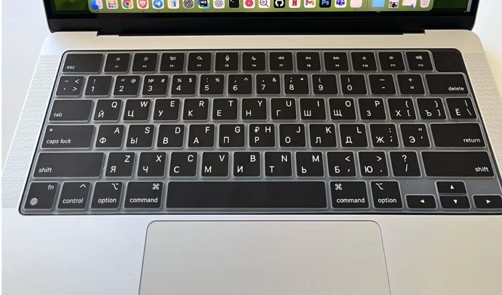 Engraving, stickers, or key replacement: what's best for a MacBook. The cover looks decent but changes the key travel. Photo.