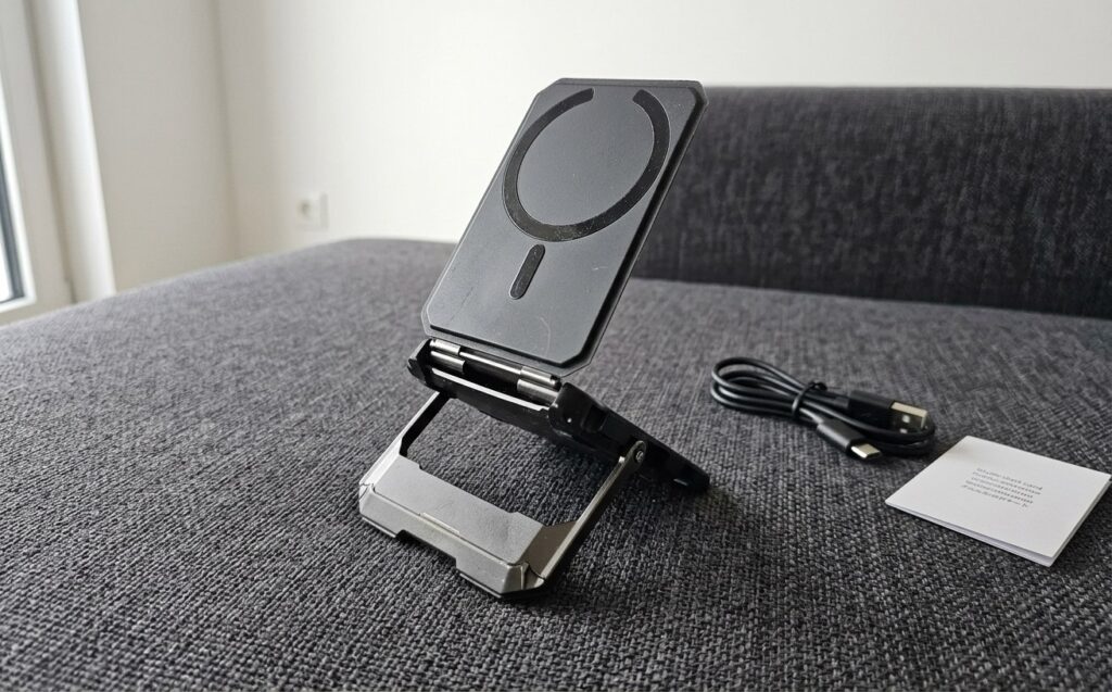 Folds into a flat disc, unfolds into a tripod — and cards fit inside