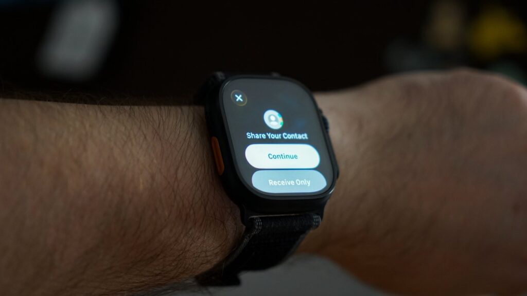NameDrop between Apple Watch and iPhone. Just bring your Apple Watch close to the iPhone and it will work. Photo.