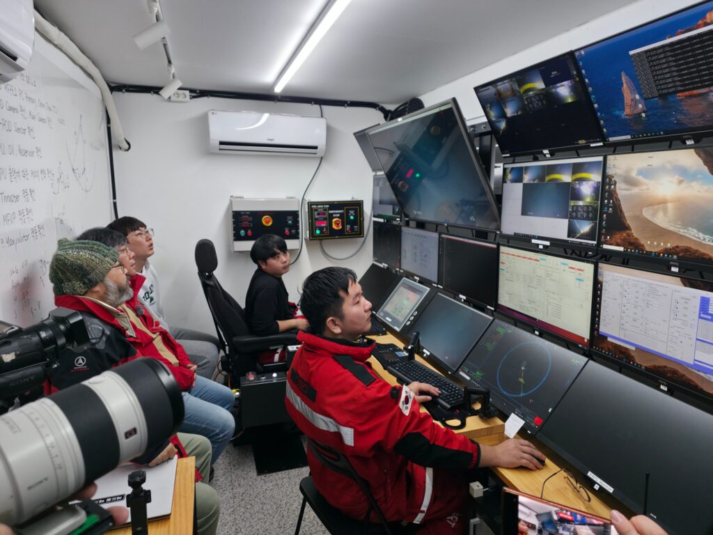 Research team conducting deep-sea exploration using an unmanned underwater vehicle. Photo.