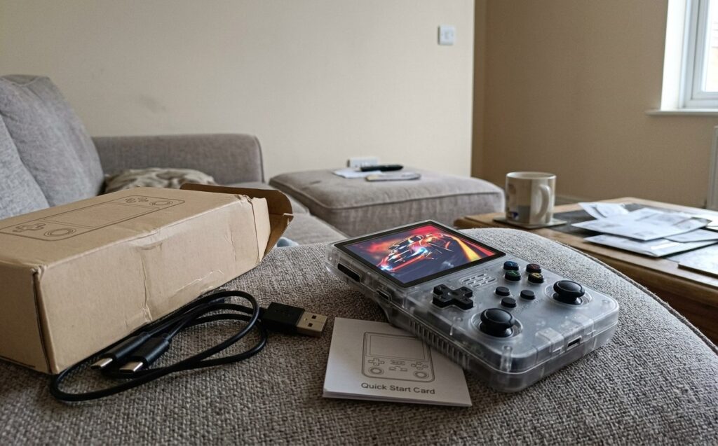 A pocket console with retro games for travel. You can enjoy gaming in the evenings. Photo.