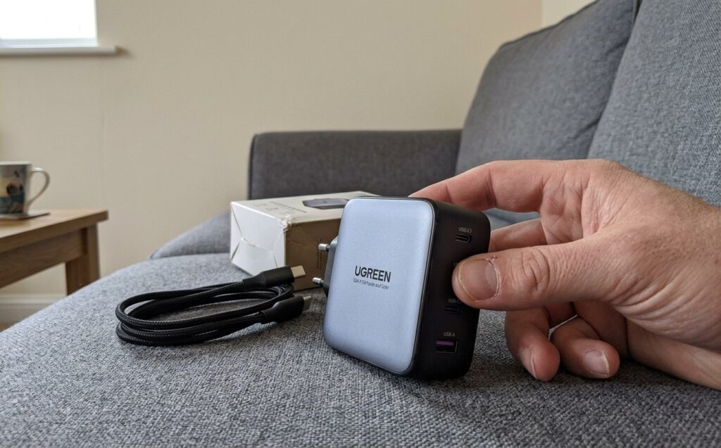 UGREEN GaN 100W charger for MacBook and iPhone. A charger with multiple ports for everything at once. Photo.