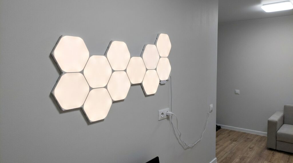 Modular Light Panels for Your Desk. Assembled six of them into a shape on the wall — I rearrange it every month. Photo.