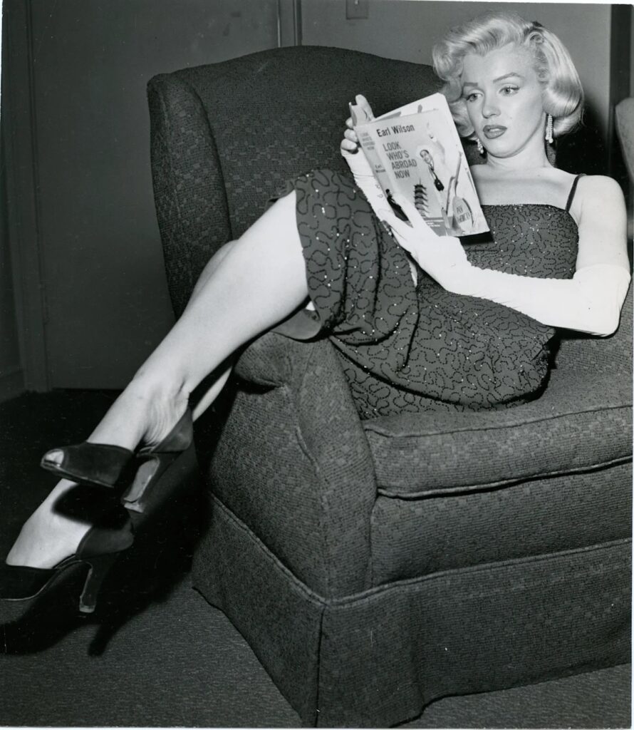 Marilyn Monroe was an avid reader. She was often seen with a book in her hands on set, while traveling, or at home. Photo.