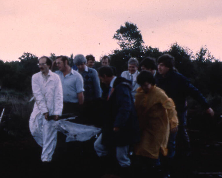 Workers extracting the remains of Lindow Man from Lindow Moss, 1984. Photo.