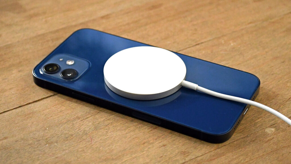 MagSafe Magnetic Charging for iPhone: How It Works. MagSafe in iPhone magnetically attaches to the back panel of the smartphone. Photo.