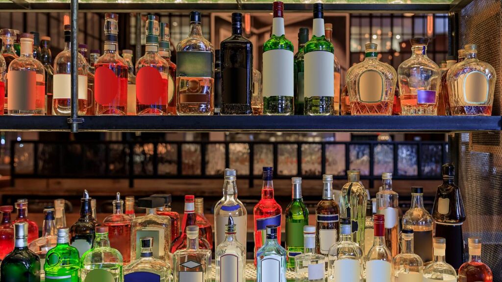 The mirror behind the bar serves several functions at once. Photo.