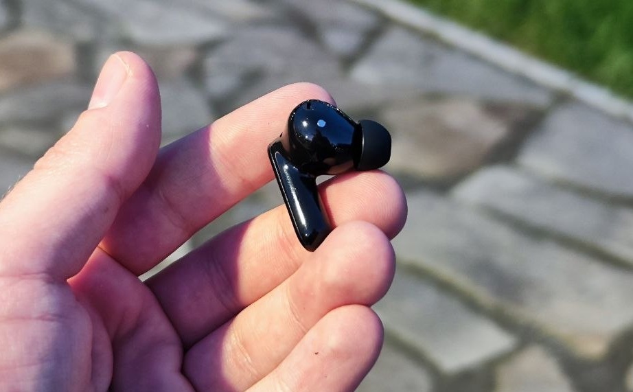 The earbuds are miniature and glossy