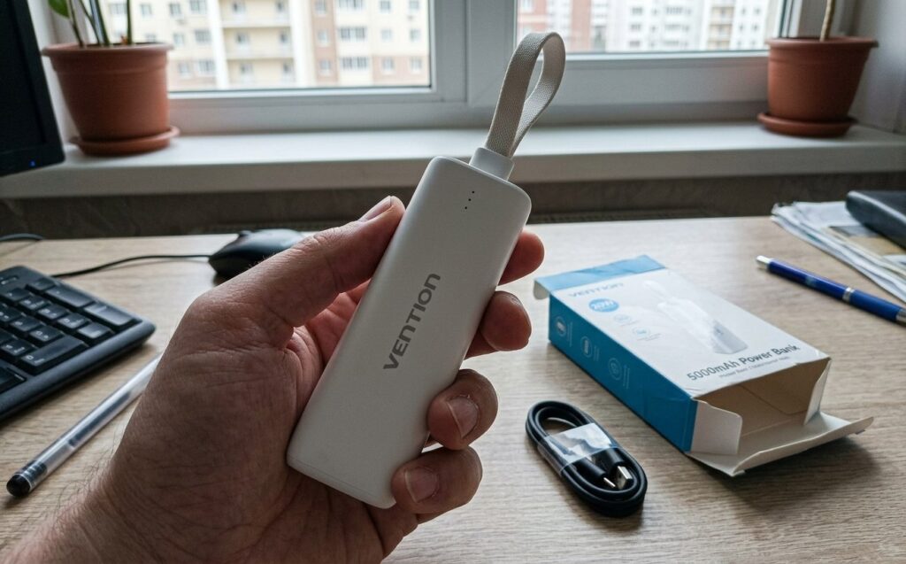 Power bank for iPhone that I carry in my shorts pocket. The lavender one went to my wife on the second day — had to keep the white one for myself. Photo.
