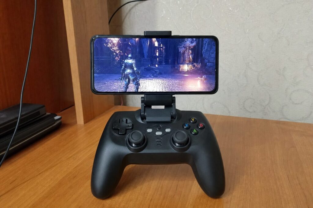 Bluetooth gamepad with phone mounted on top