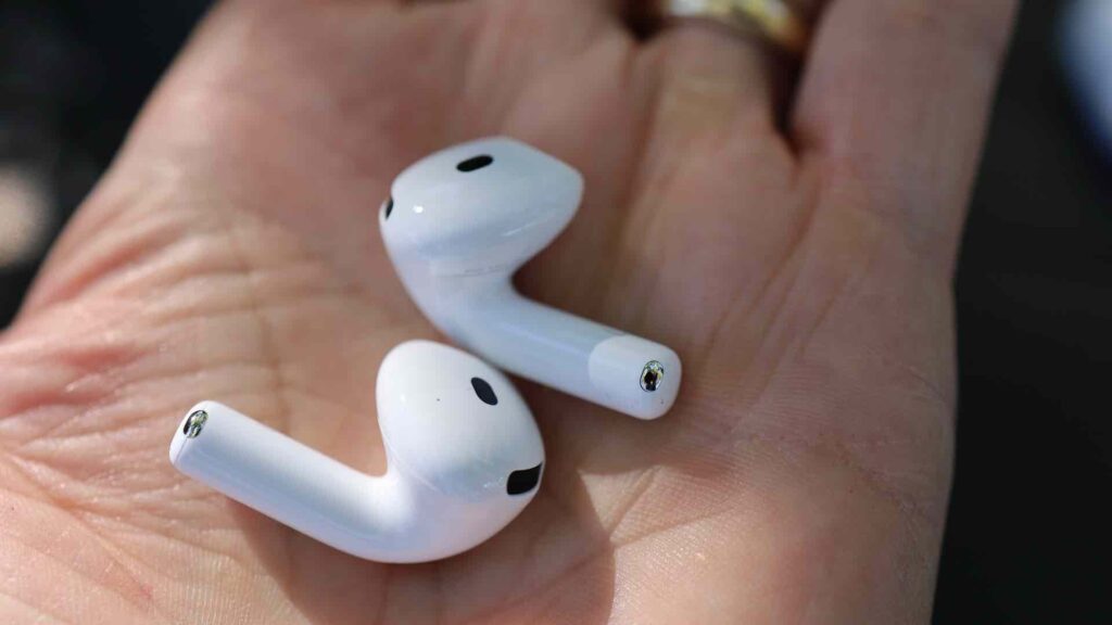 AirPods 5 held in a hand