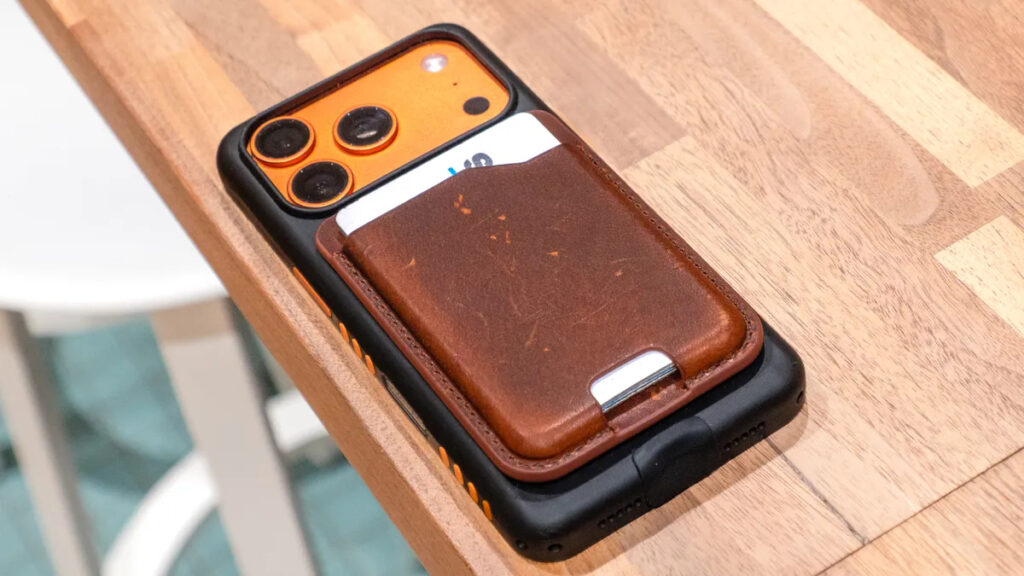 A MagSafe wallet on the back of an iPhone