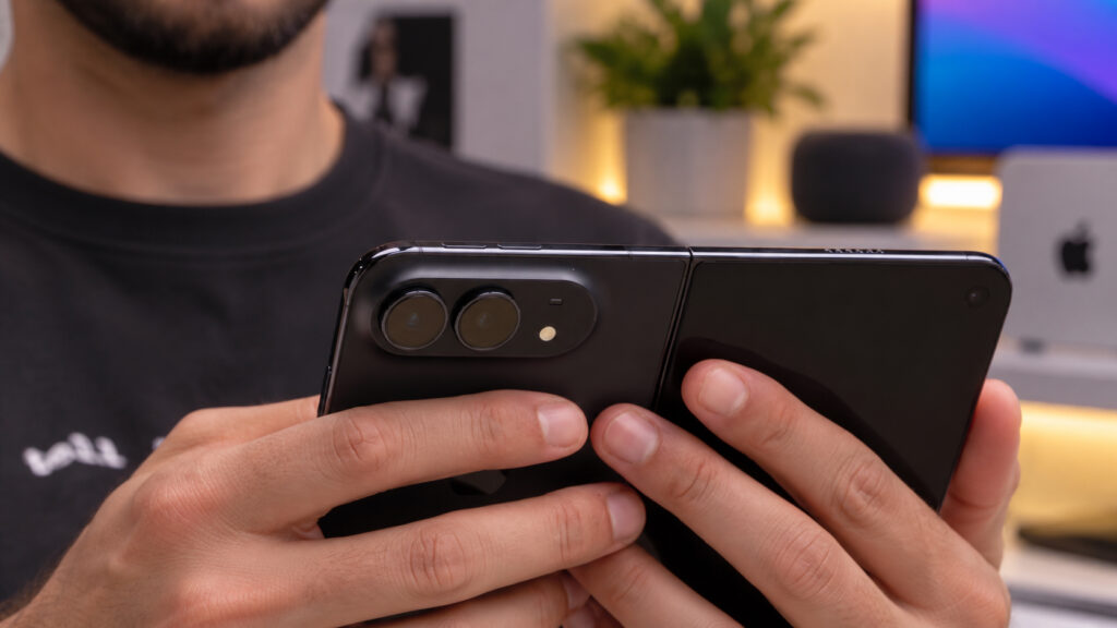 How the folding iPhone looks in person. An unfolded iPhone Duo held in the hands. Photo.