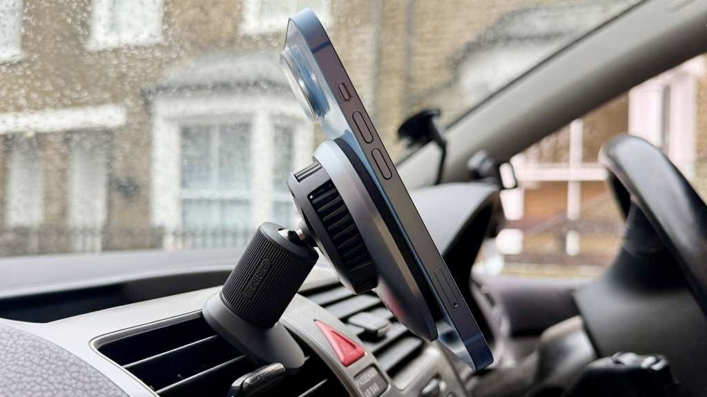 An iPhone on a magnetic mount connected to a wireless charger
