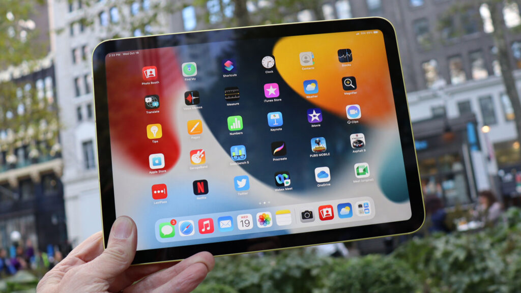 An iPad (2022) held in a hand