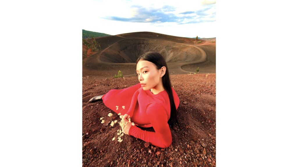 A woman in red lying on the ground