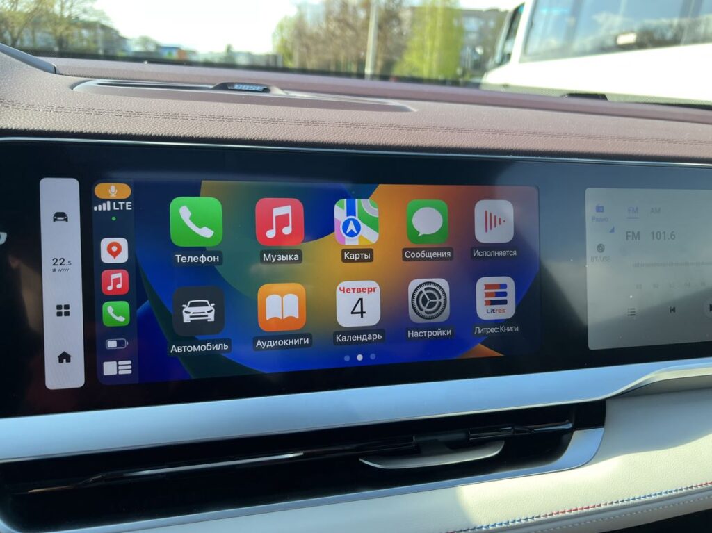 CarPlay in a Geely Monjaro connected through a dedicated adapter